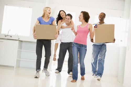 Moving team working around Docklands apartment access and building entry
