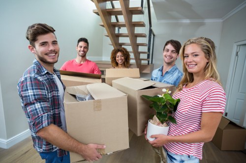 Removal van and moving boxes in a Docklands residential area