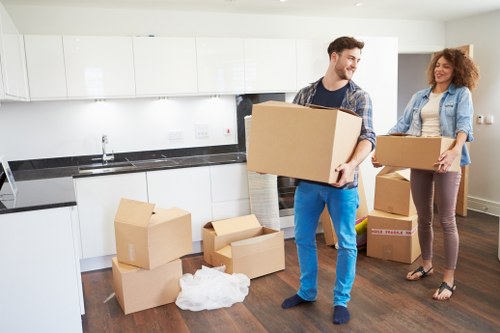 Furniture loading during a Docklands move in a busy urban area