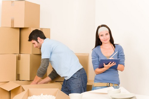 Workers handling office items carefully during a commercial relocation