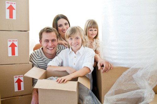 Professional removal team packing household belongings for a Docklands move