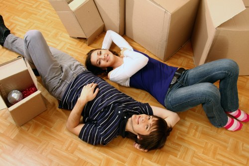 Moving team handling household items in a Docklands apartment building