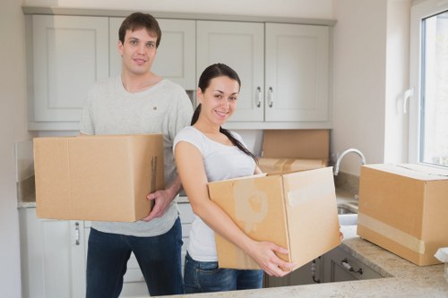 Team handling desks and furniture during a Docklands office move